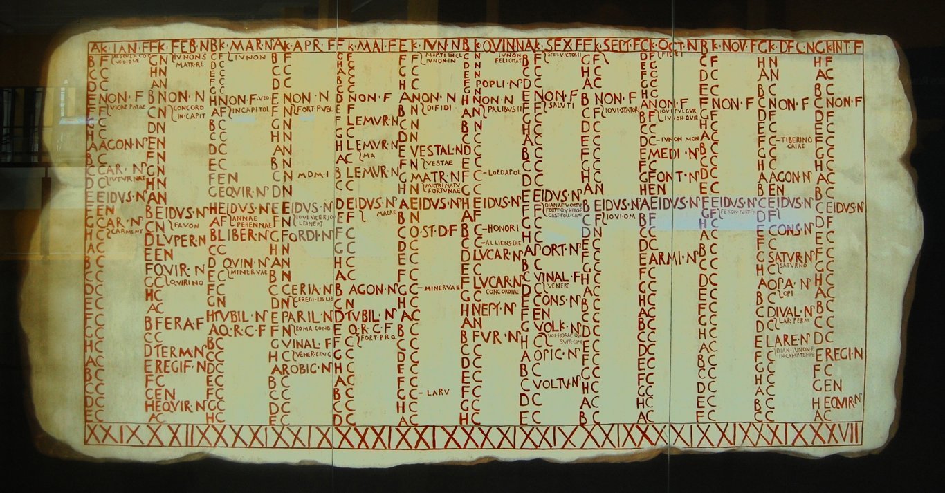 Reconstructed Anzio calendar (Fasti Antiates), displayed at the Museo del Teatro de Caesaraugusta (Zaragoza, Spain). This calendar is dated between 84 and 55 BC. - 
The original fragments are kept in the Museum of the Baths of Diocletian in Rome.