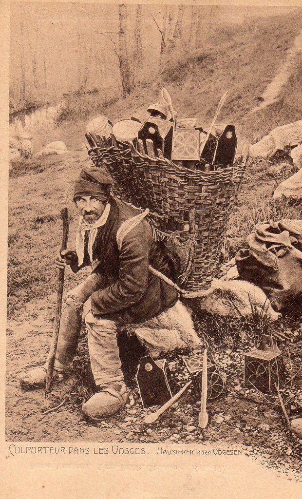 Pedlar and his pack with its assorted contents, in the Vosges, postcard, 1925