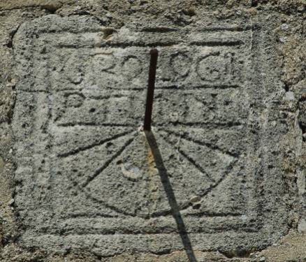 Canonical sundial engraved on a south wall of the church of Notre-Dame-de-Porporières at Mérindol-les-Oliviers in the Drôme. It is grandly described as a clock by the inscription above it, OROLOGII, and dates from the 12th or 13th century.